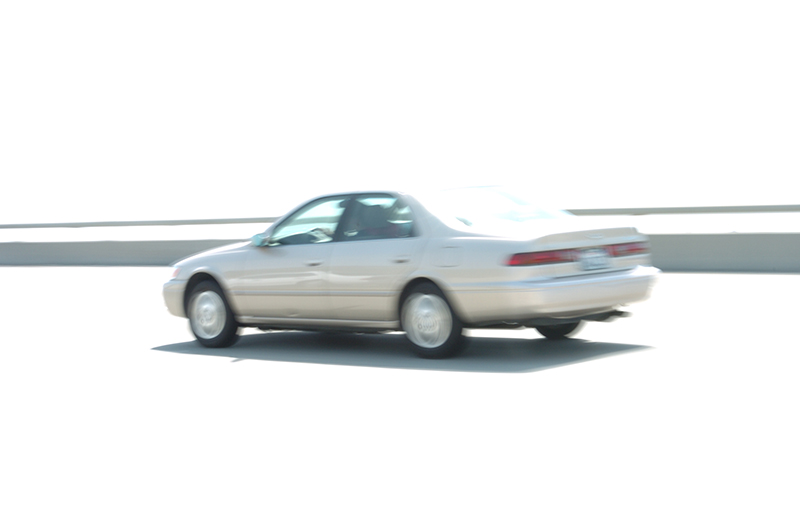 20040425 143852 0709
This high key shot was taken on the coastal highways.  Overexposure was used to blow out the street, sky and background leaving just the guardrail and shadow visible.  A slower shutter speed was also used to create motion blur to give the sense of speeding car.
